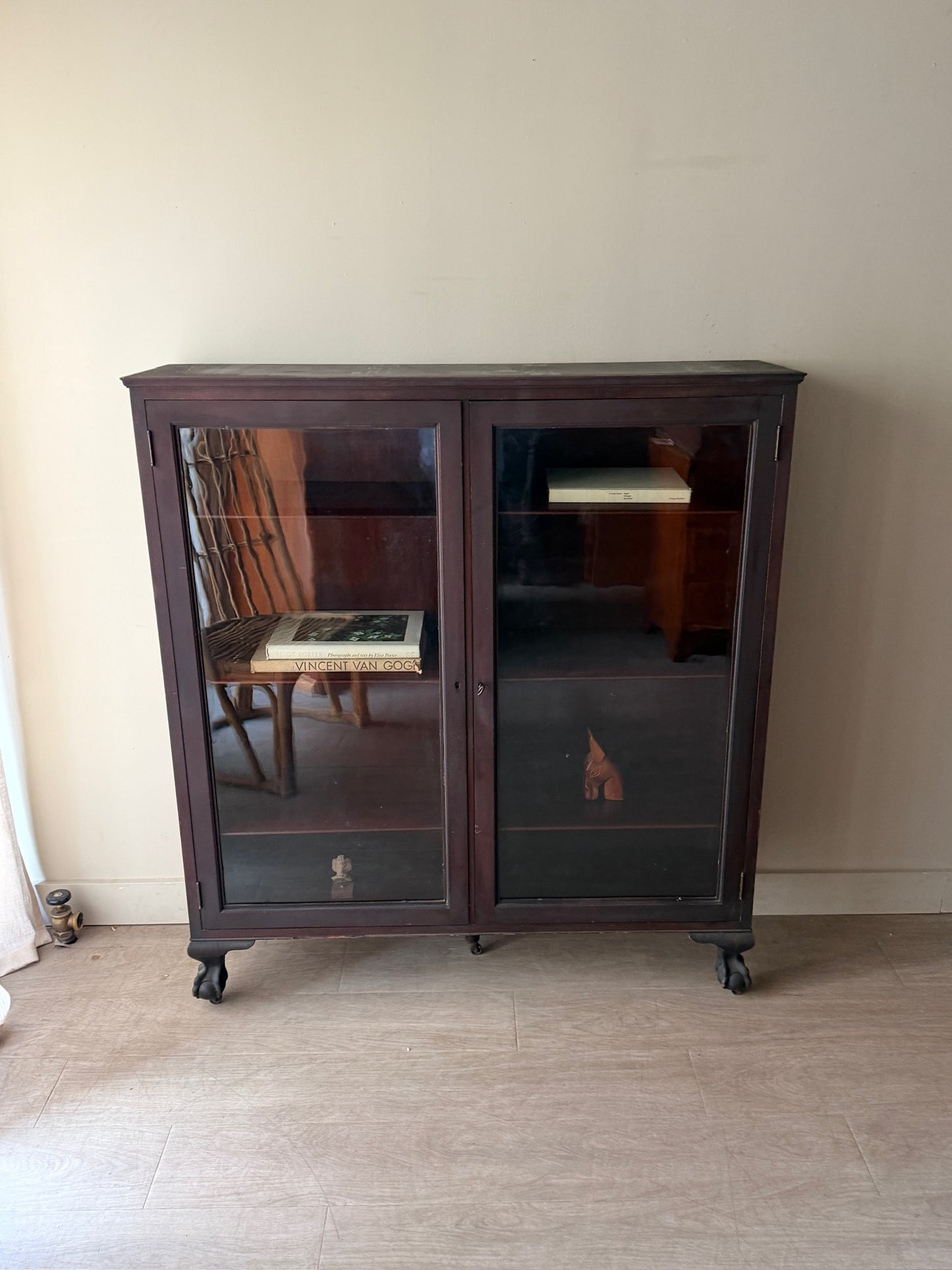 Mahogany claw foot display cabinet