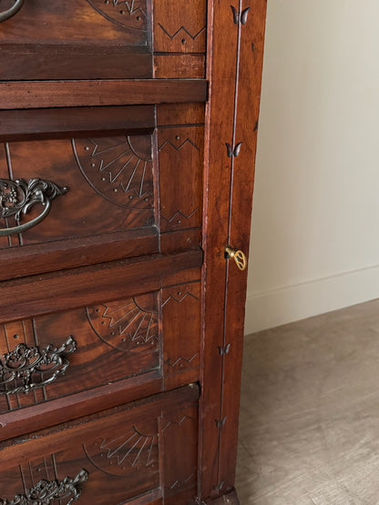 Carved Eastlake walnut dresser with side lock