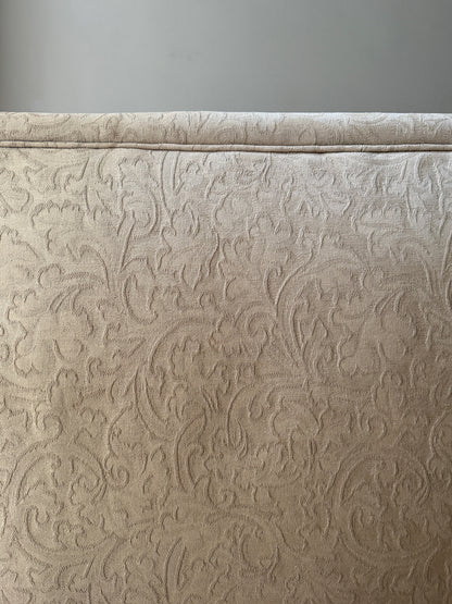 Damask upholstered settee with turned walnut legs