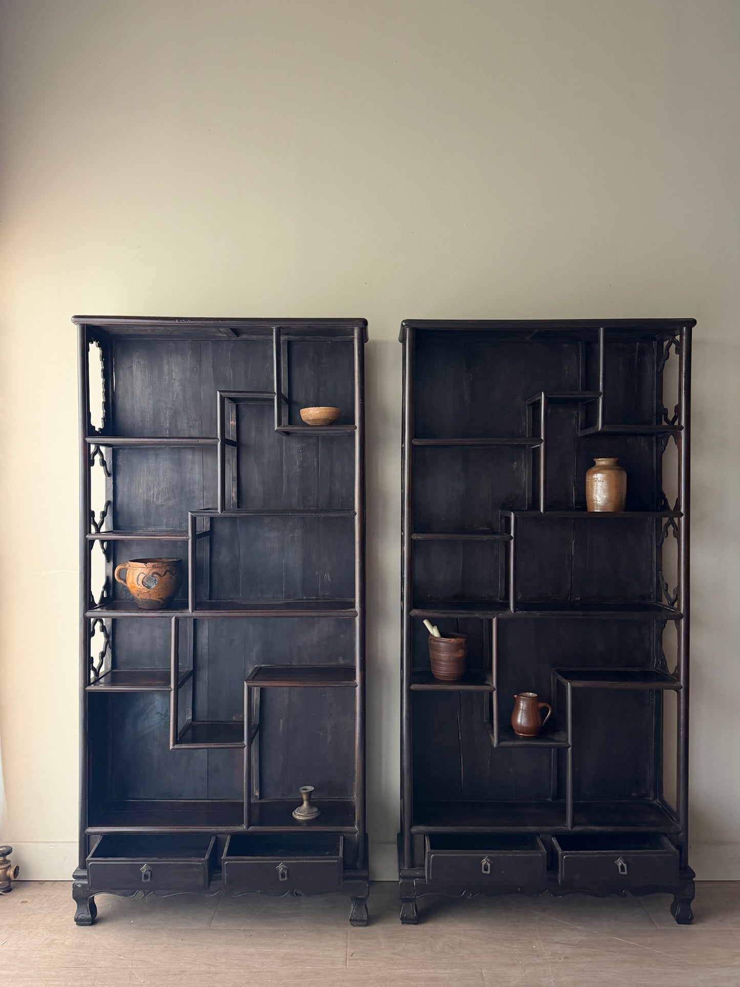 2 carved rosewood etageres. Sold individually.