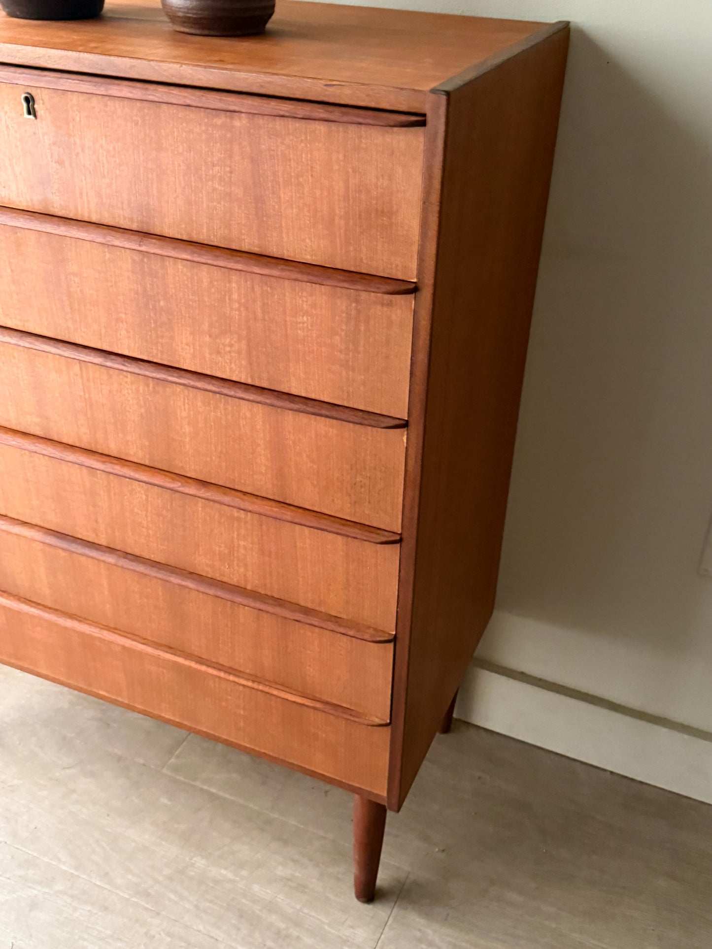 Danish teak tallboy dresser (left)