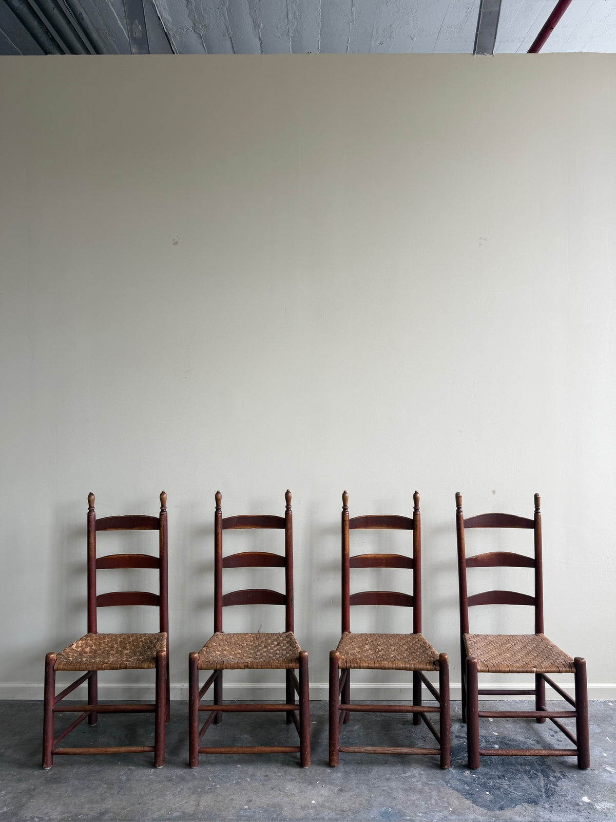 Pennsylvania painted maple ladder back chairs. Sold in pairs.