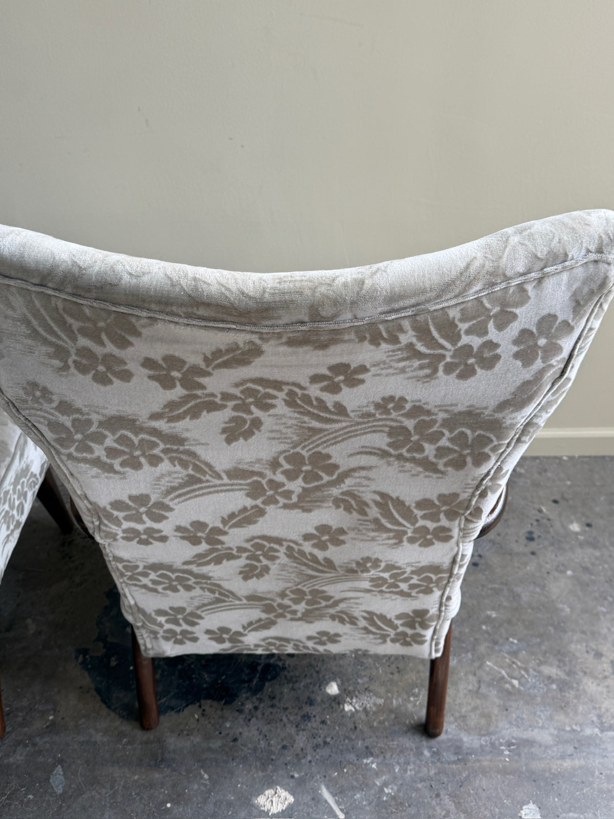Danish wingback grey floral velvet lounge chairs (left)