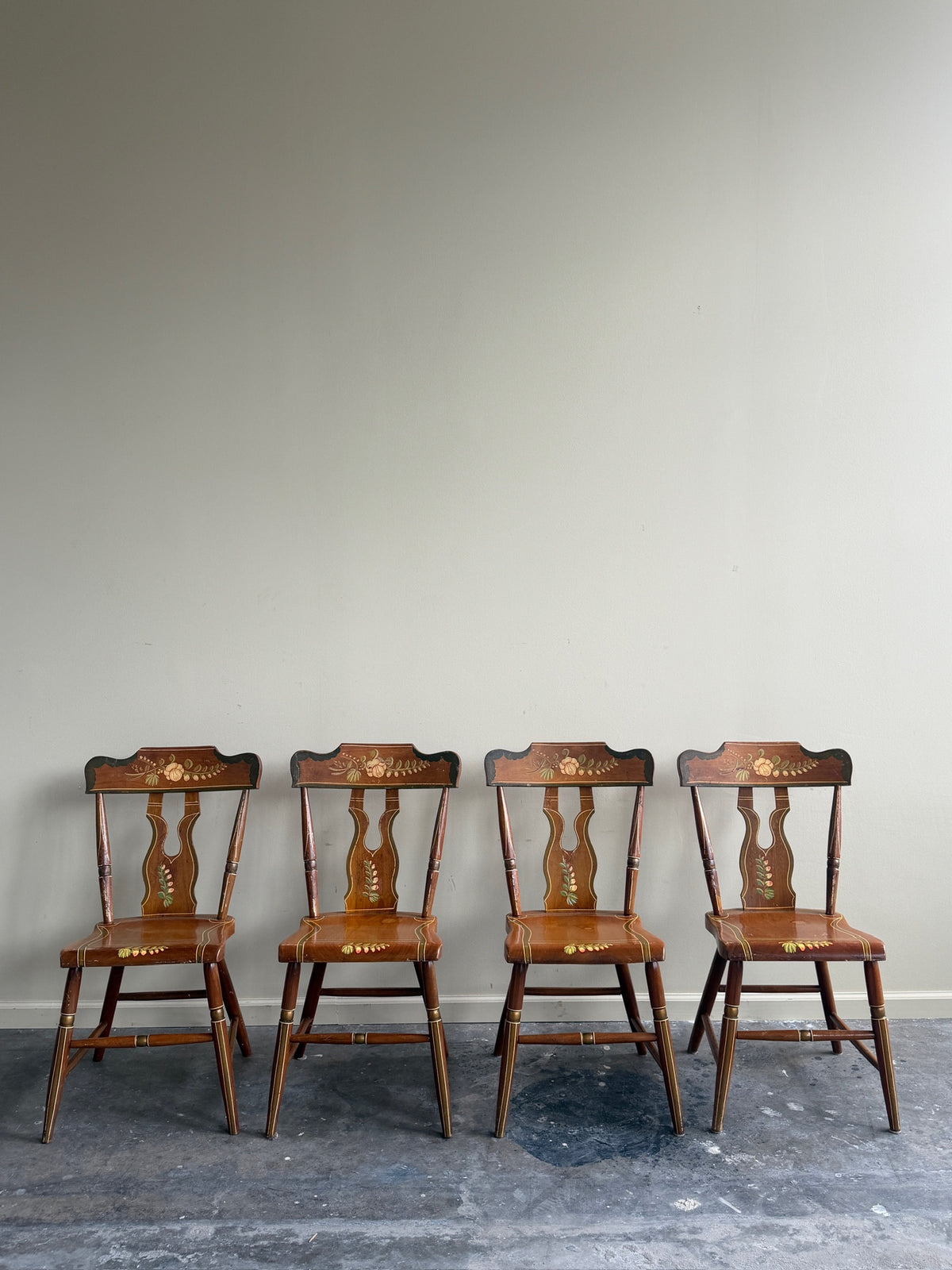 Pennsylvania painted pine plank seat dining chairs. Sold in pairs.