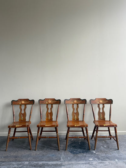 Pennsylvania painted pine plank seat dining chairs. Sold in pairs.