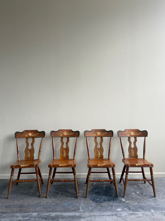 Pennsylvania painted pine plank seat dining chairs. Sold in pairs.