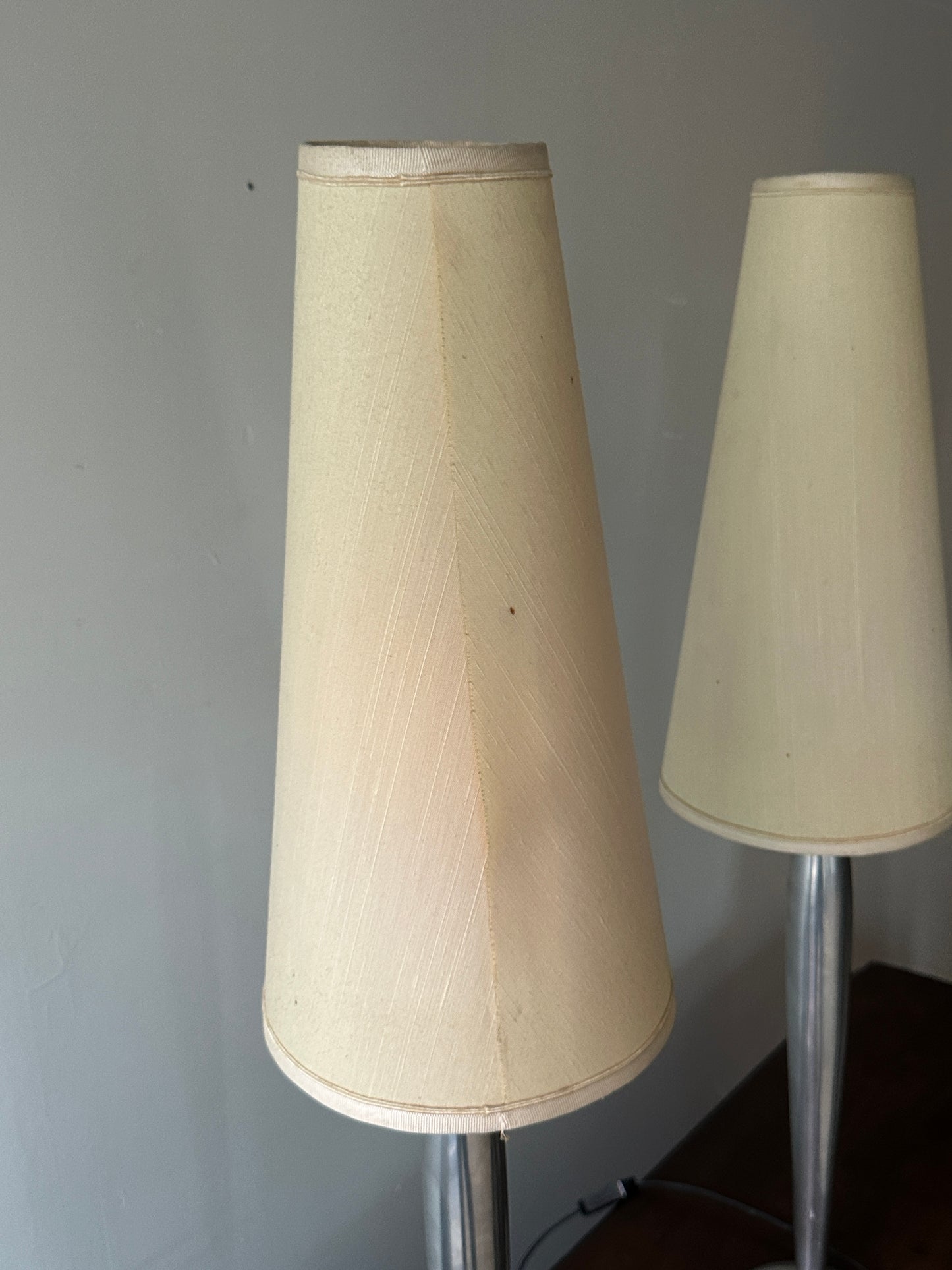 Lucien Gau Paris brushed crome table lamps. Sold as a pair.