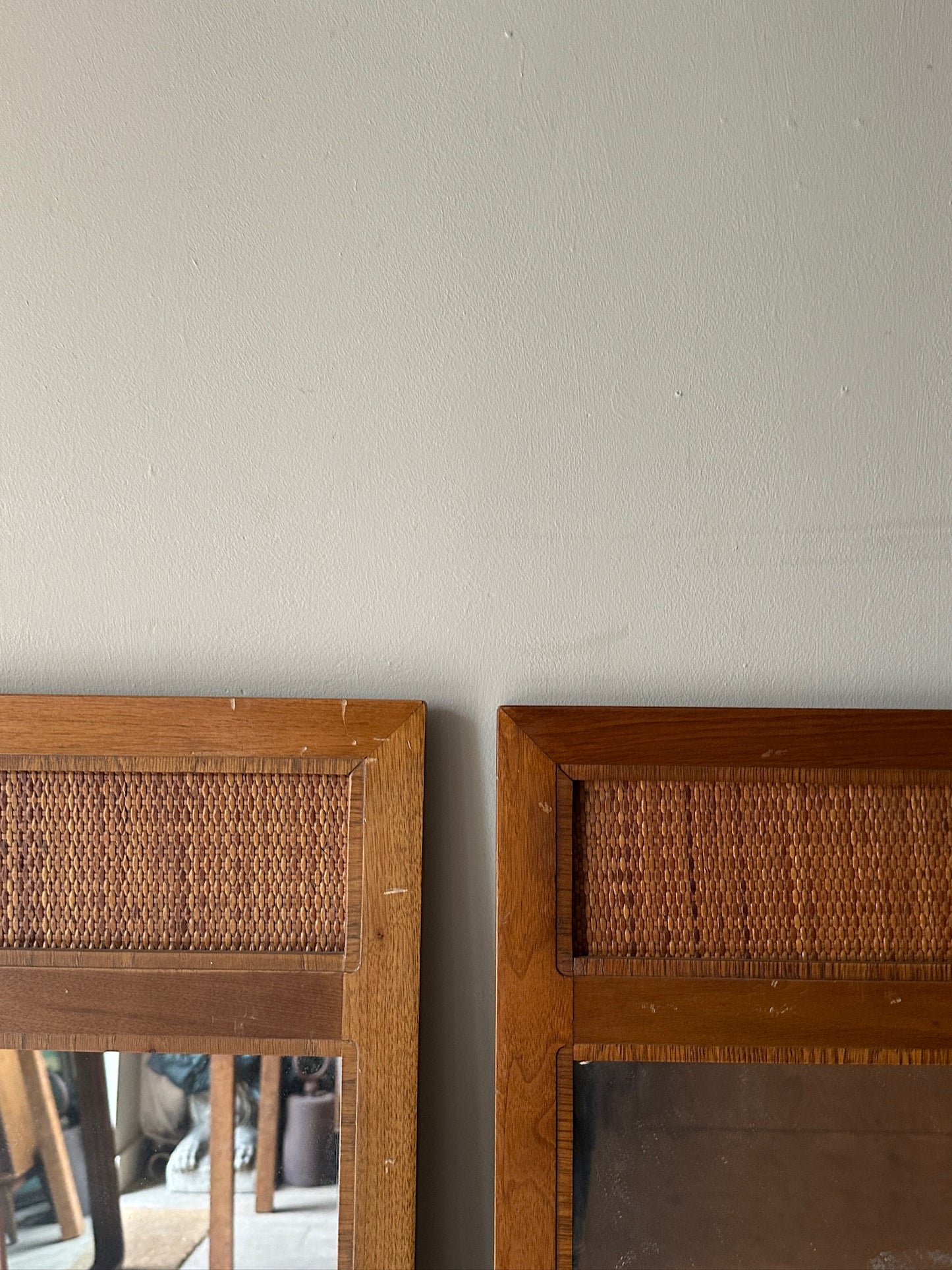 2 walnut and cane mirrors. Sold individually.