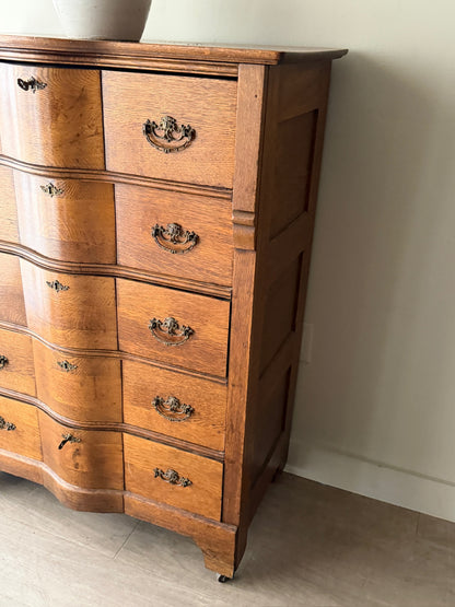 Oak serpentine tallboy dresser