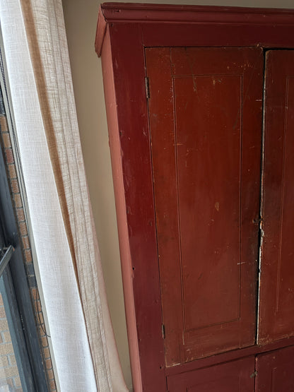 Red painted farmhouse cupboard