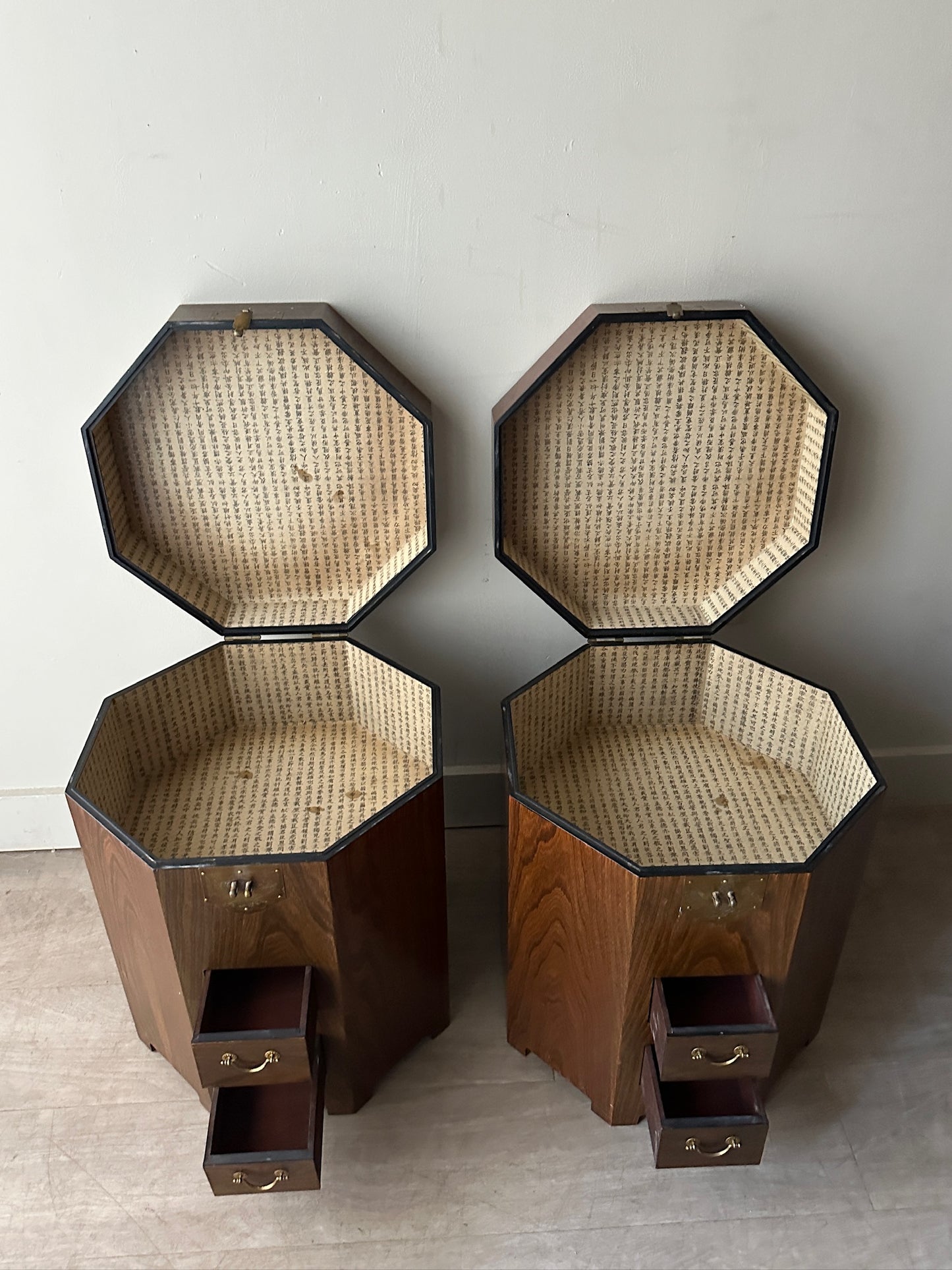 2 octagonal rosewood side tables. Sold individually.