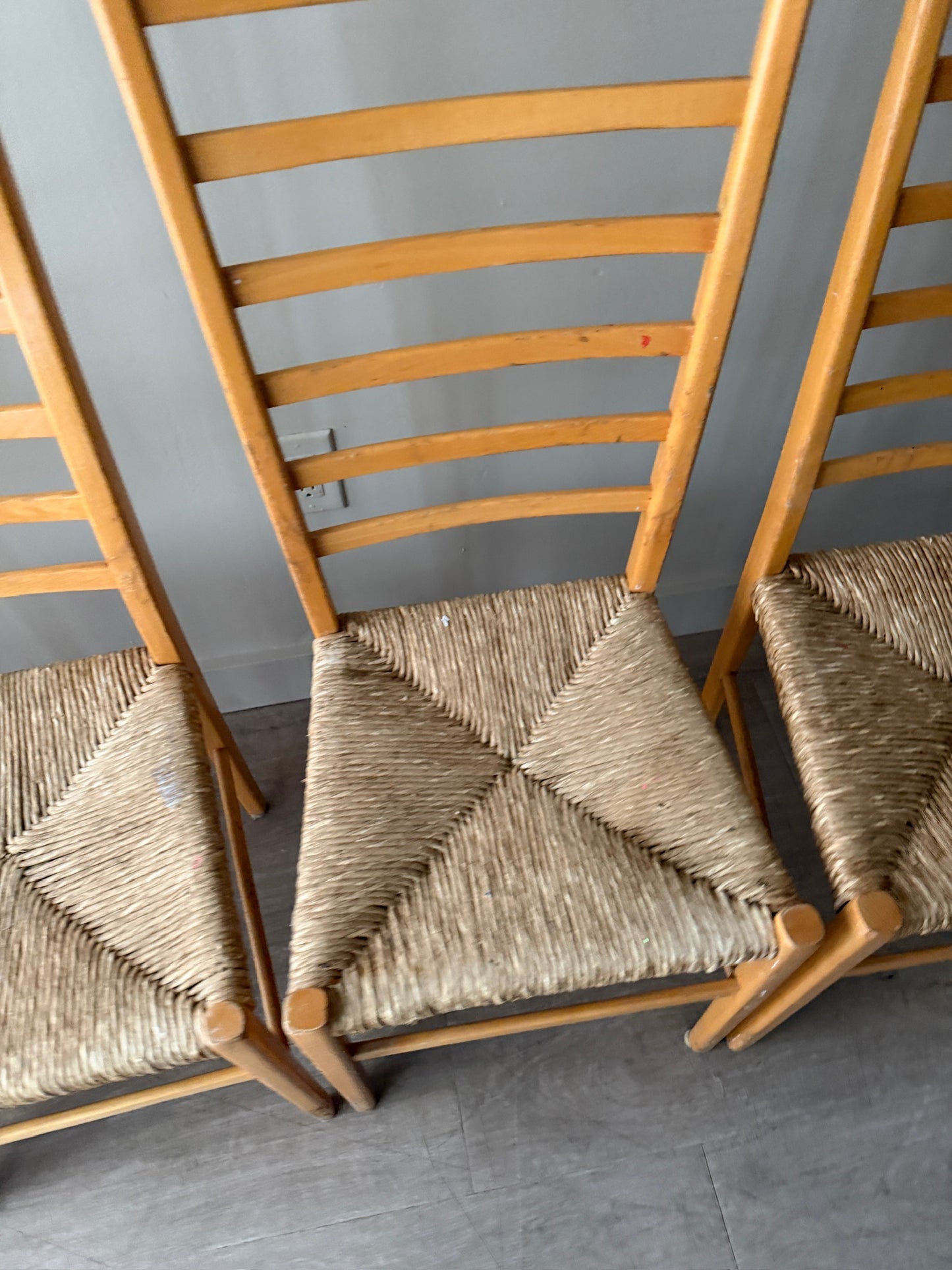 Maple ladder back dining chairs with rush seats. Sold in pairs.