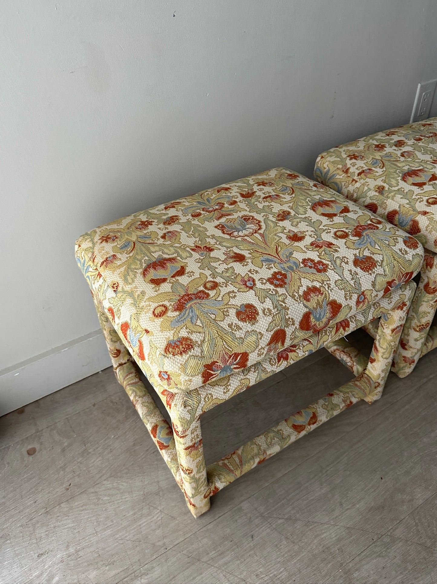 2 Milo Baughman floral upholstered stools or ottomans. Sold individually.