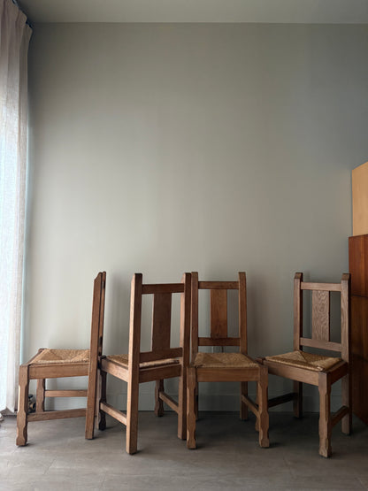 Belgian De Puydt oak & rush dining chairs. Sold in pairs.