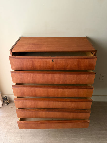 Danish teak tallboy dresser (left)