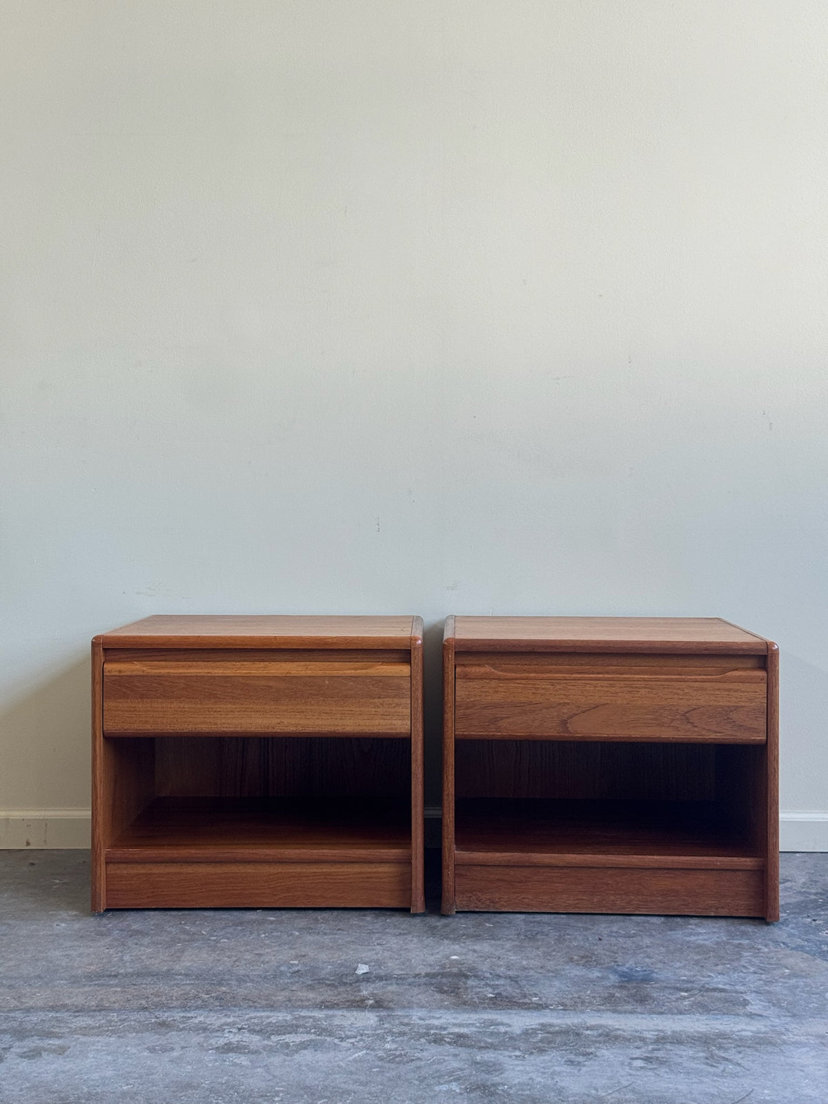 Danish teak nightstands. Sold as a pair.