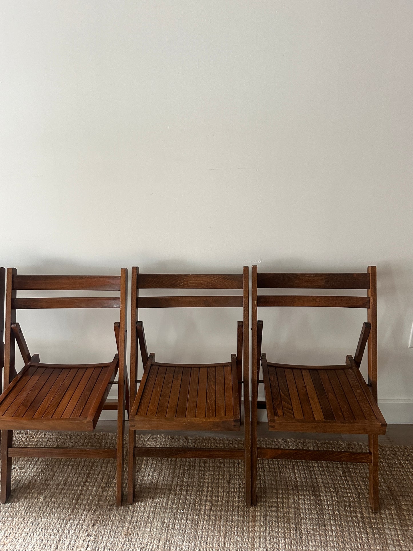 Oak folding chairs. Sold individually.