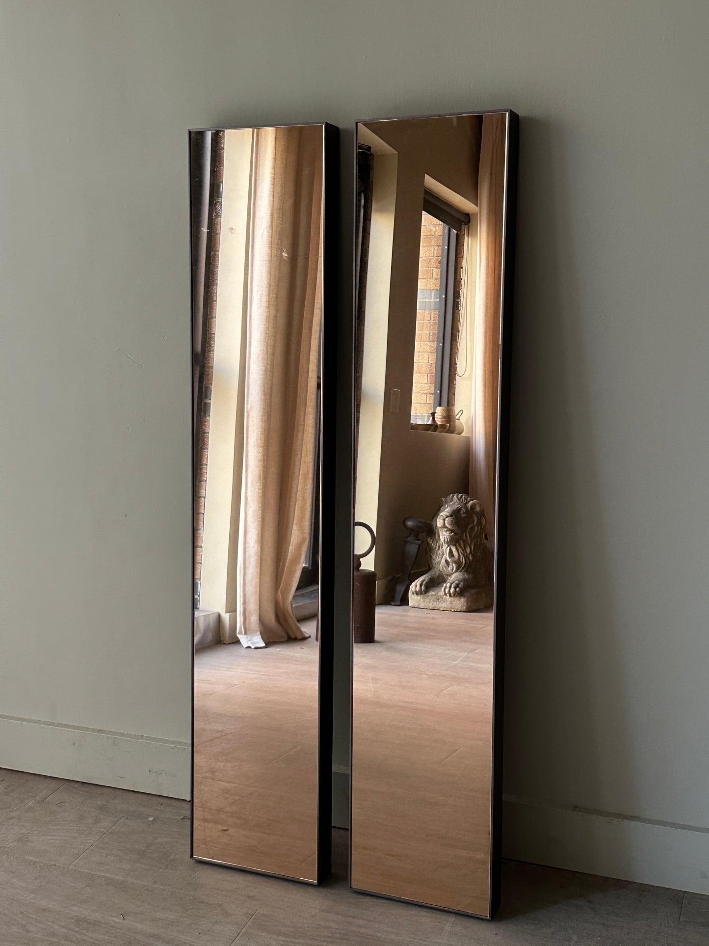 Pair of copper tinted wall mirrors. Sold together.