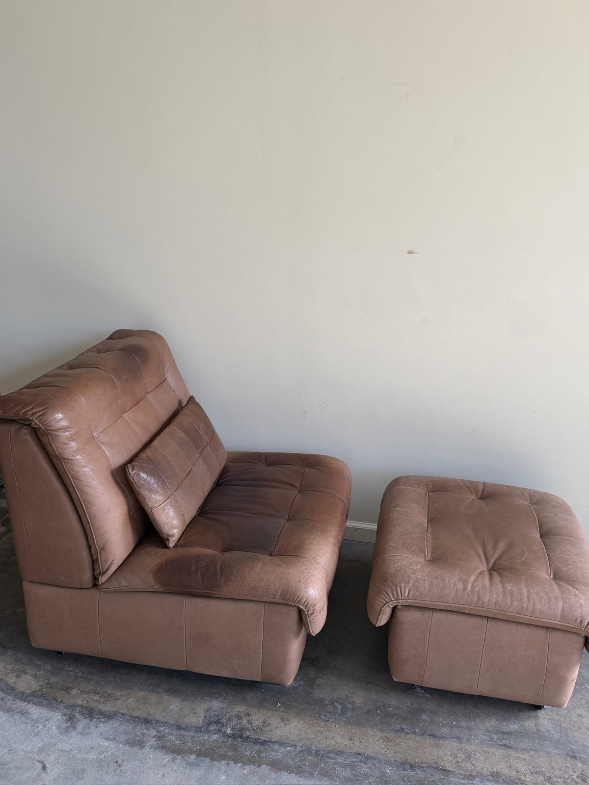 Swiss brown leather lounge chair with ottoman