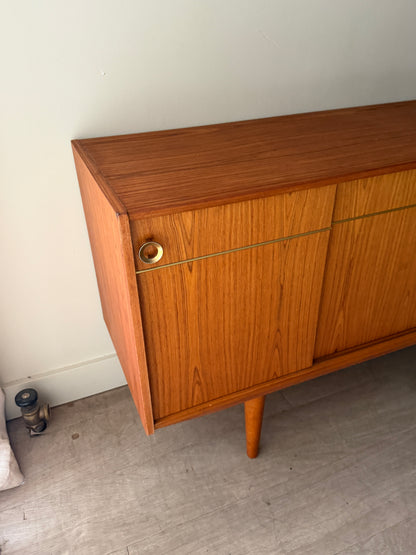 Danish teak sideboard with brass hardware