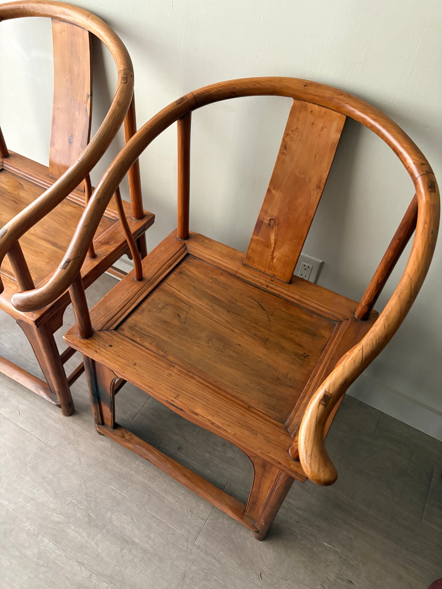 Chinese elmwood yoke back armchairs. Sold individually