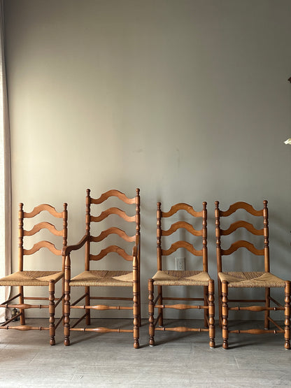 Set of 4 maple and rush dining chairs. 3 armless, 1 arm. Sold as set