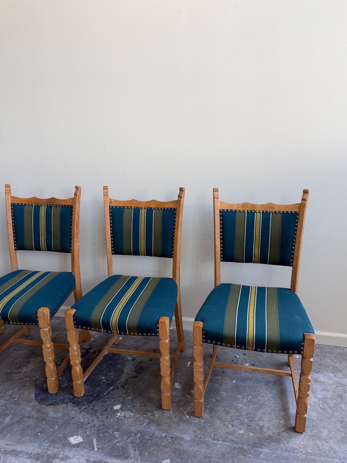 Henning Kjaernulf oak upholstered dining chairs. Sold in pairs.