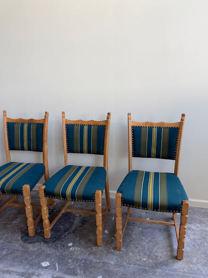 Henning Kjaernulf oak upholstered dining chairs. Sold in pairs.