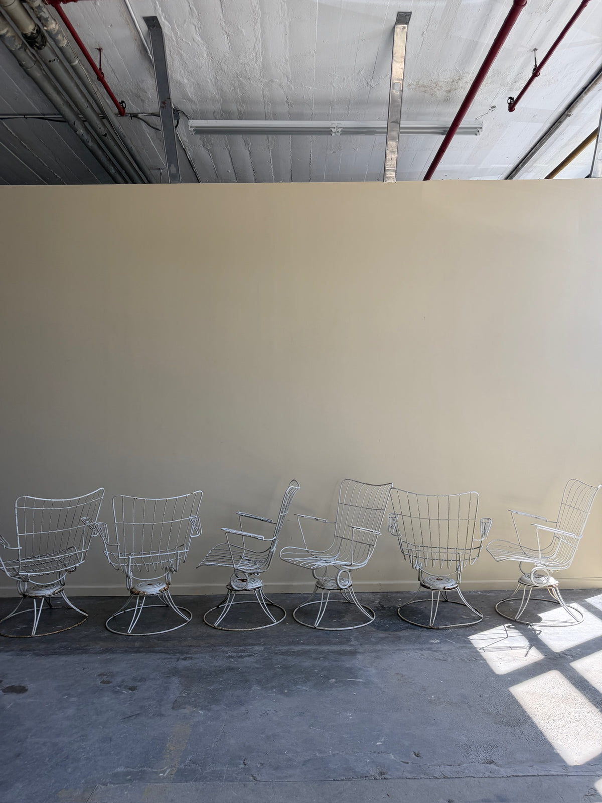 White swivel patio chairs. Sold individually.