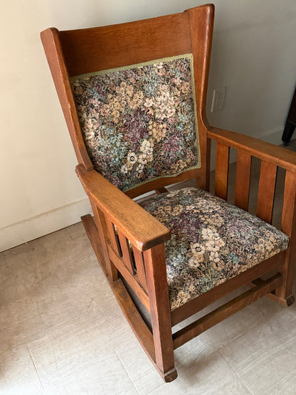 Upholstered golden oak rocking chair