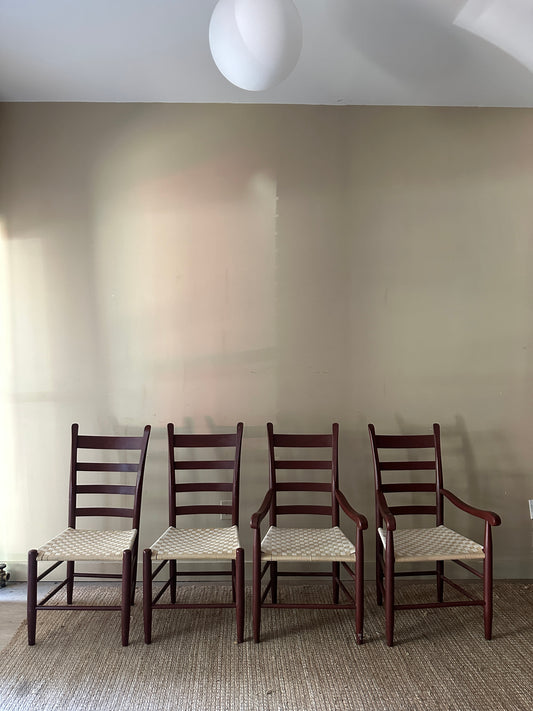 Woven chairs with arms. Sold as a pair.