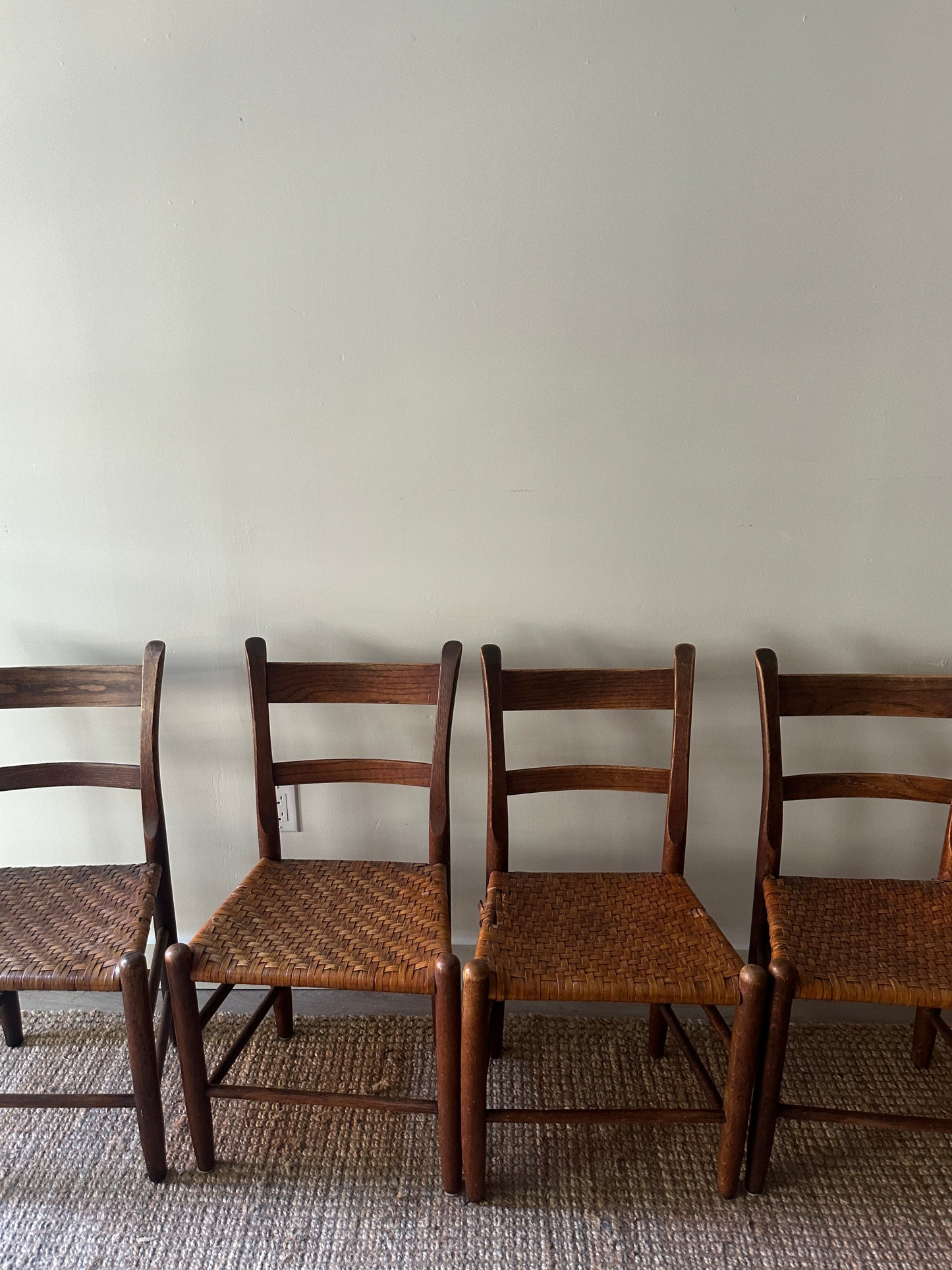 4 woven chairs. Sold individually.