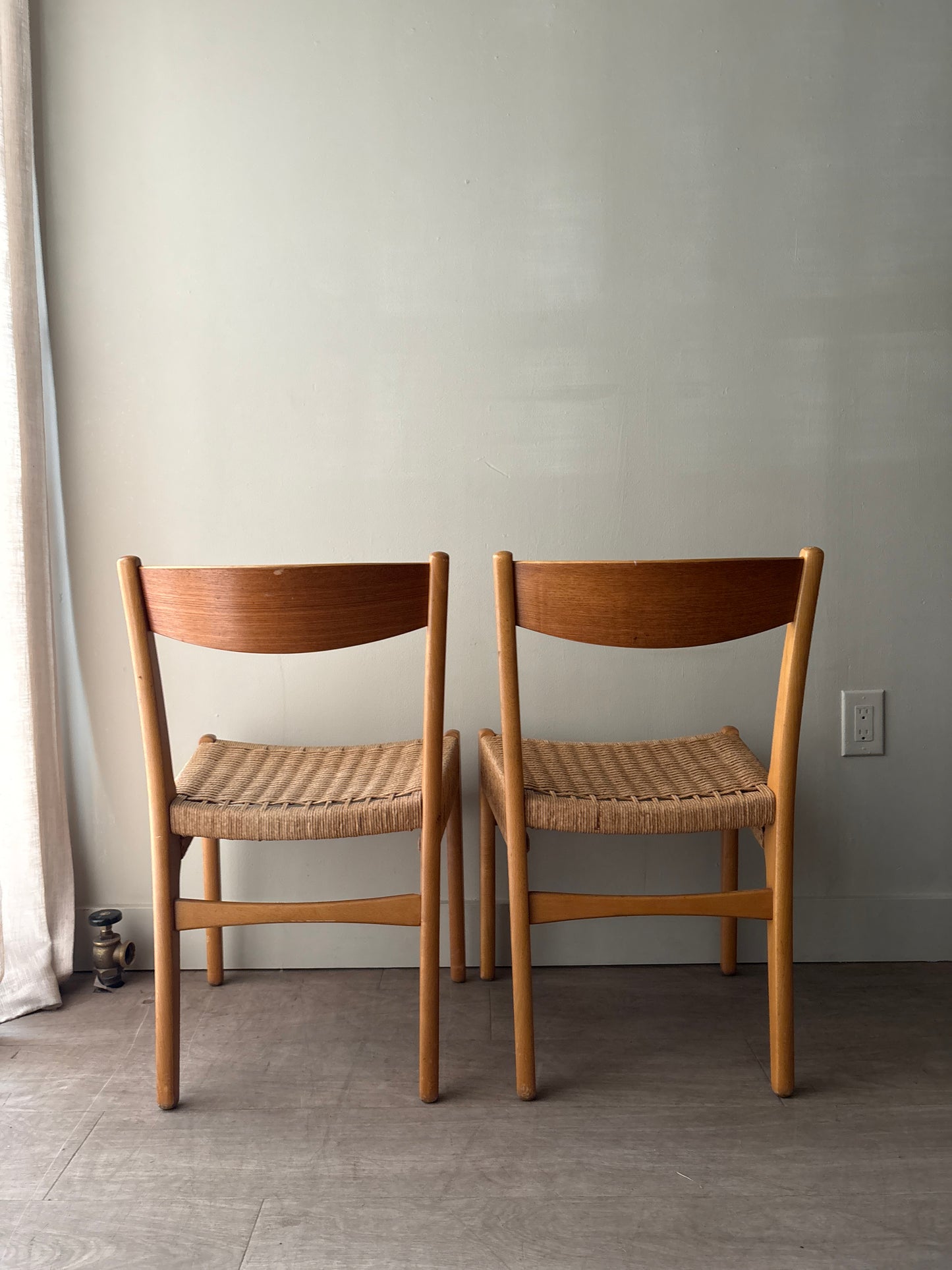 Swedish teak twisted rope seat dining chairs. Sold as a pair.