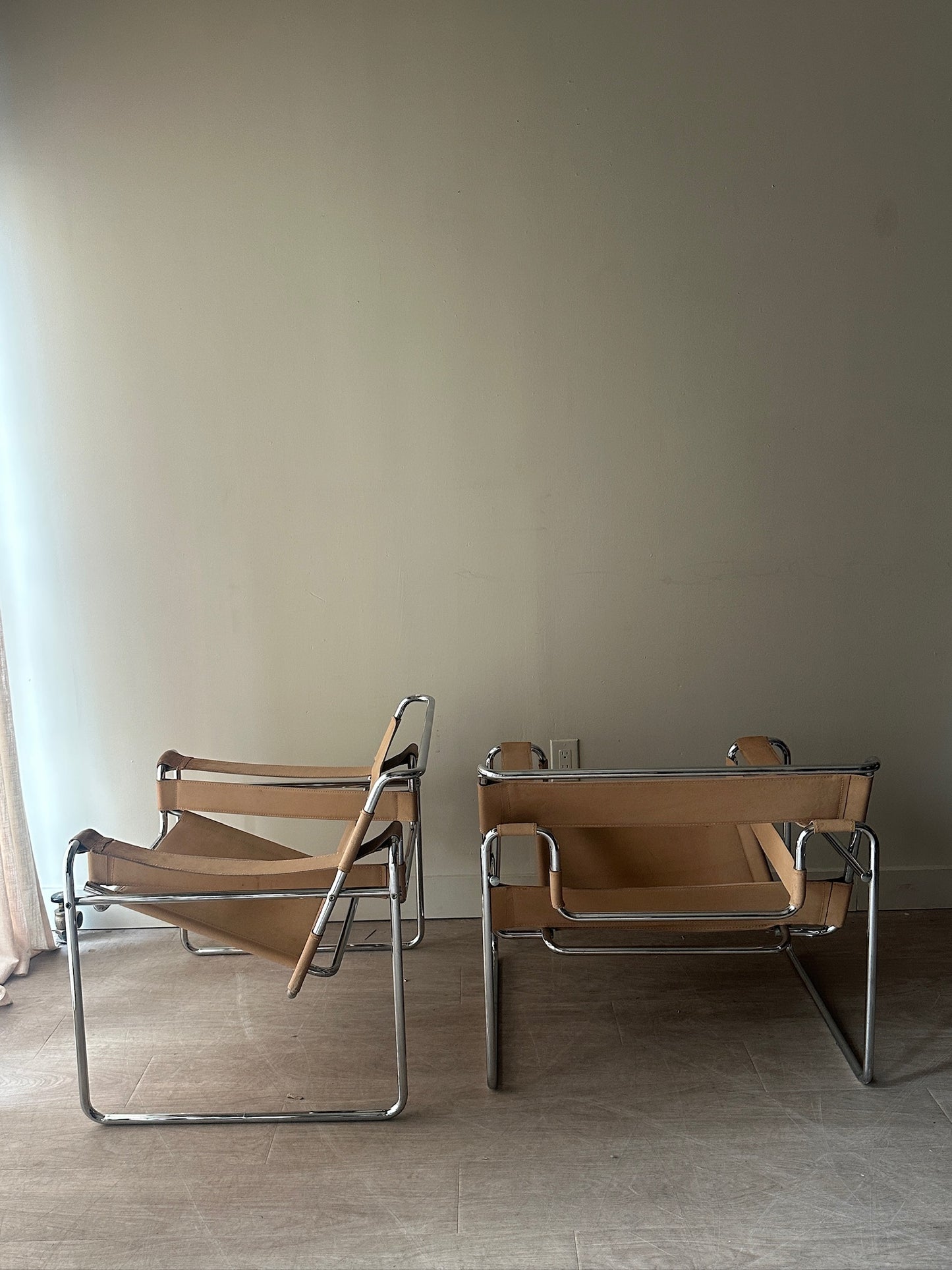 Tan Wassily chairs. Sold individually.