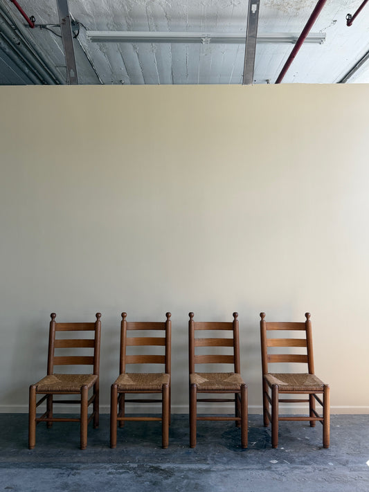 French oak rush seat dining chairs. Sold as a set of 4.