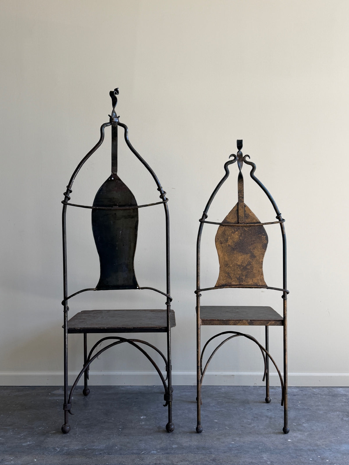 Wrought iron sculptural chairs (right)