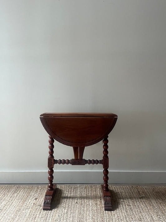 Carved drop leaf entryway table