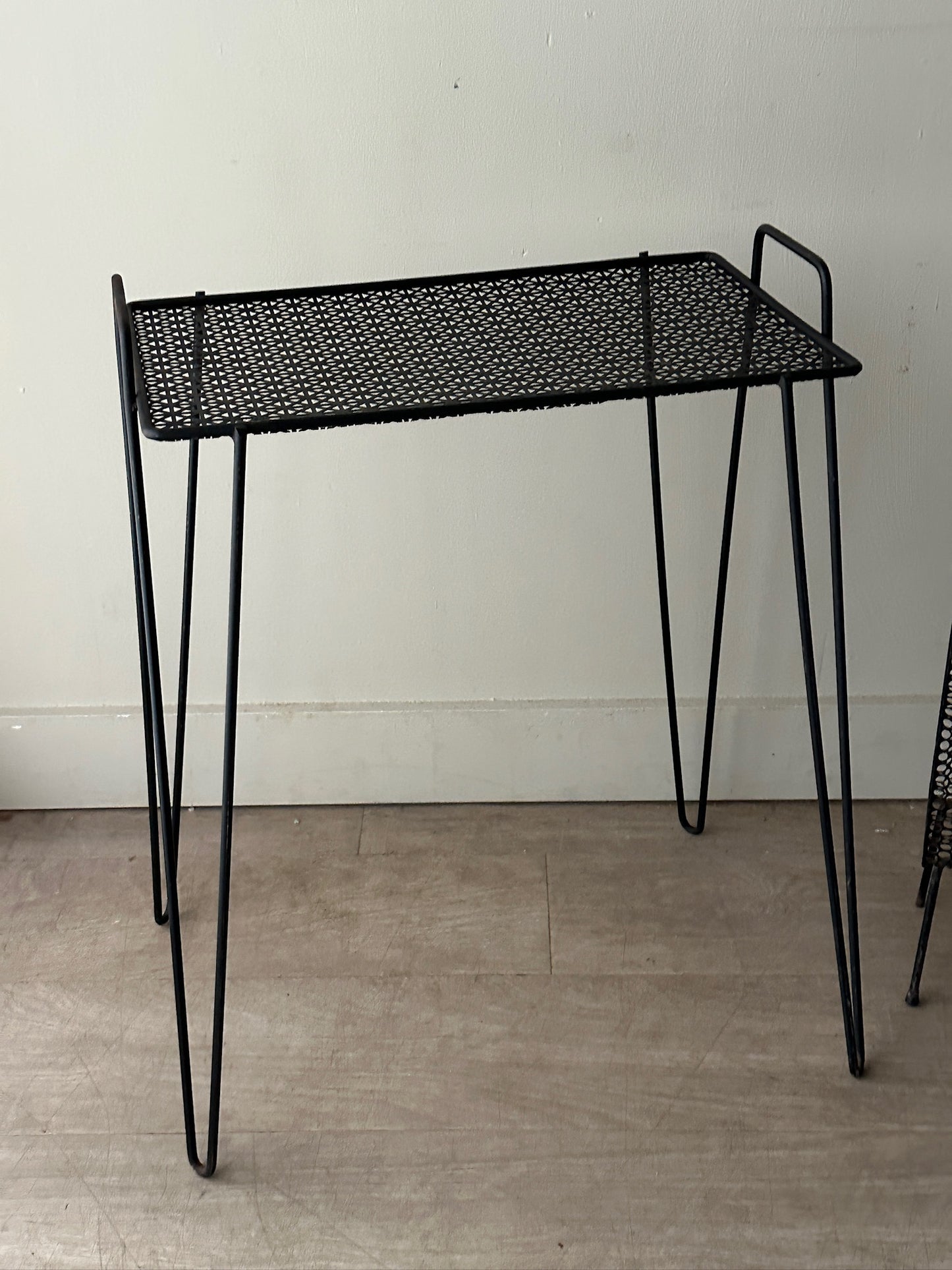Black metal mesh side table (left)