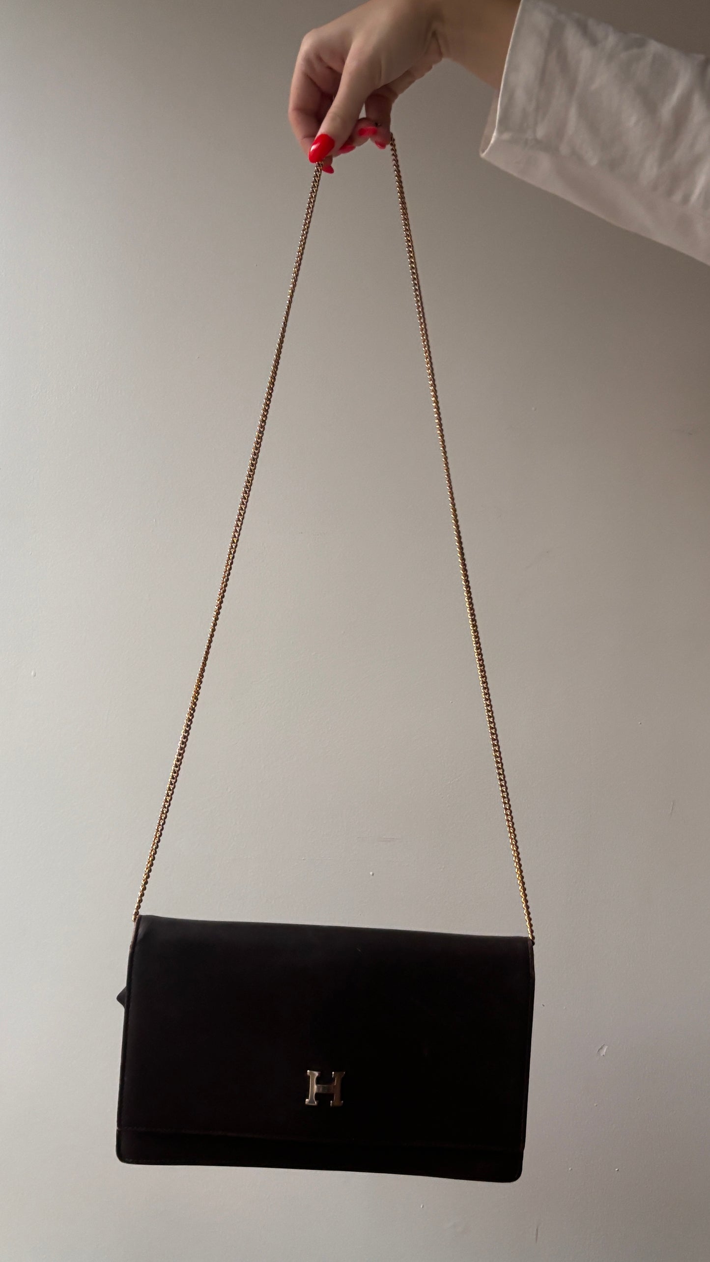 “H” leather clutch with chain strap