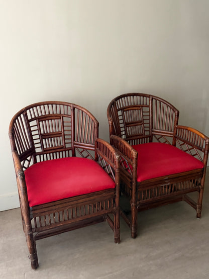 Rattan armchairs. Sold individually.