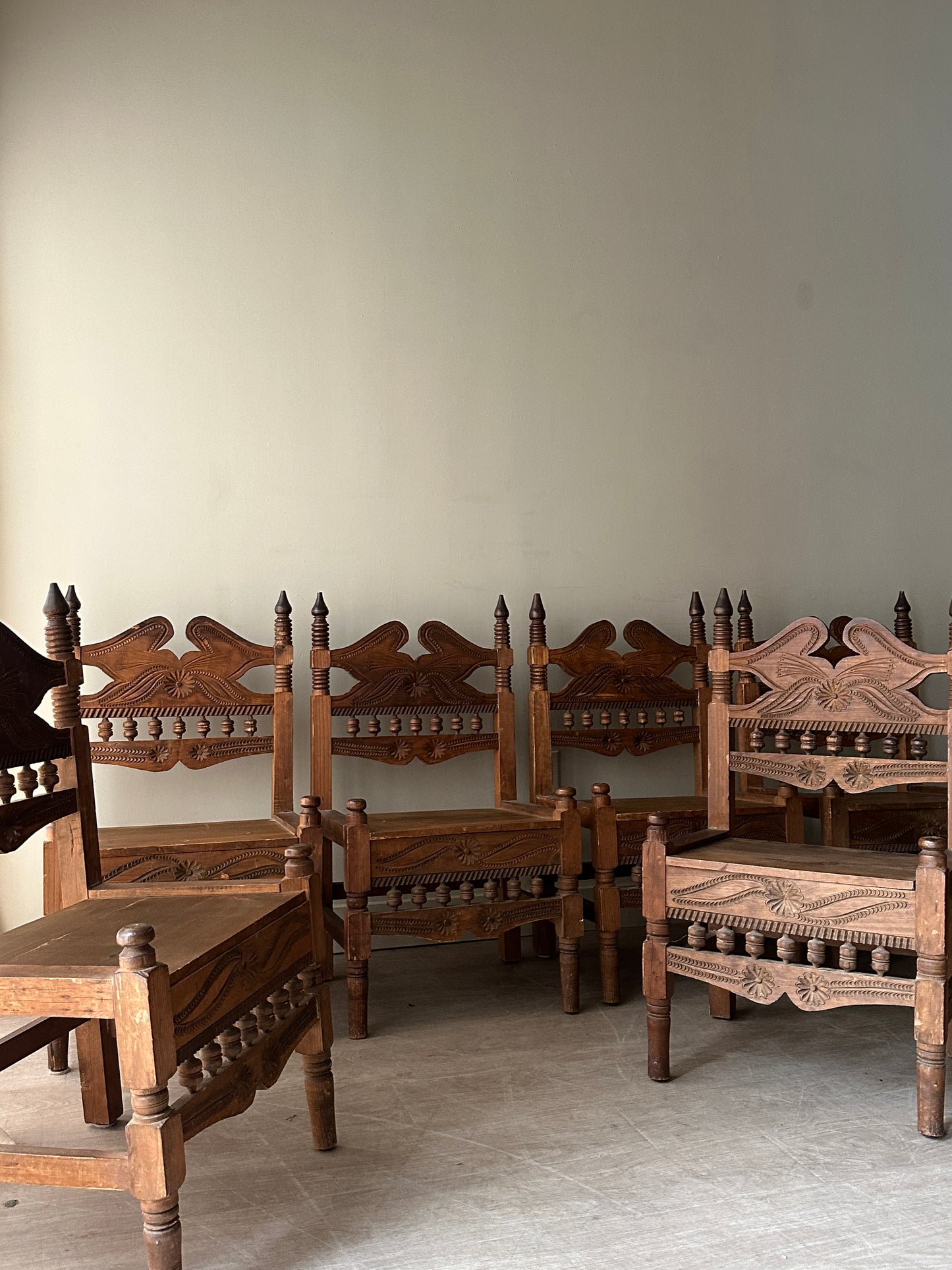 6 hand carved chairs. Sold individually.