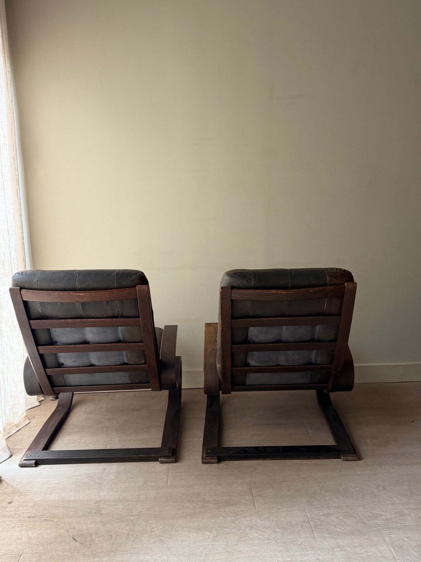 Danish beech bentwood and leather lounge chairs. Sold individually.