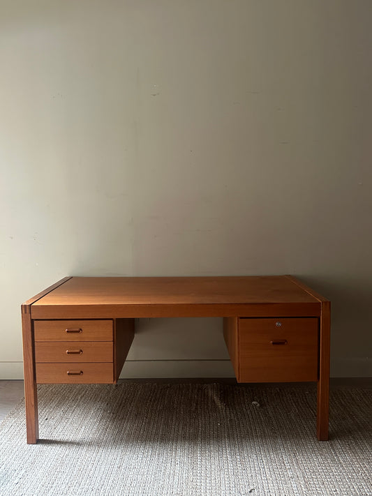 Teak desk. Right drawer locked.