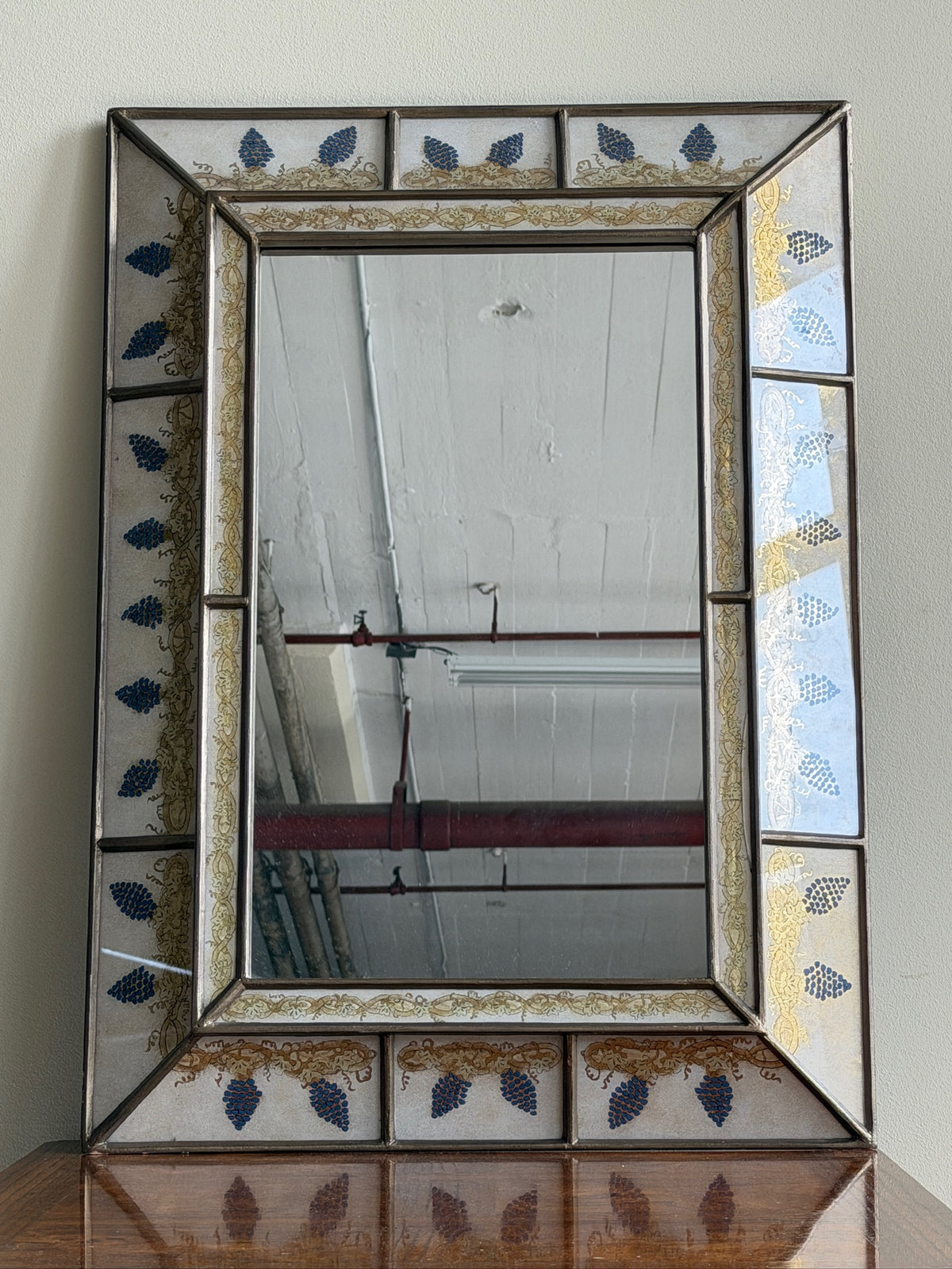 Reverse painted glass mirror