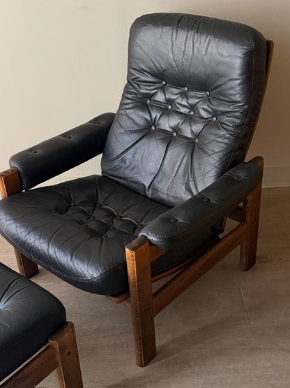 Reclining leather armchair with ottoman