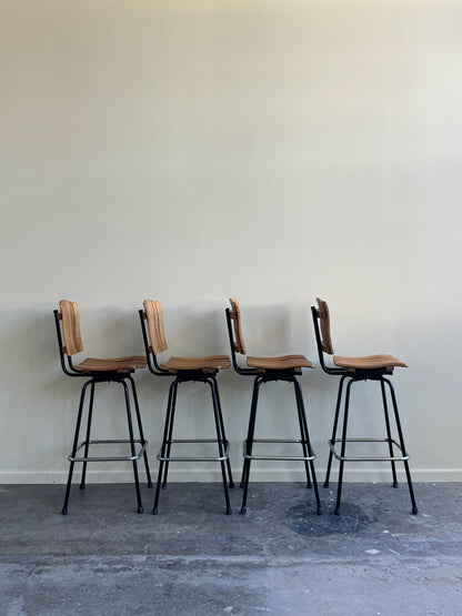 Slatted maple swivel bar stools. Sold in pairs.