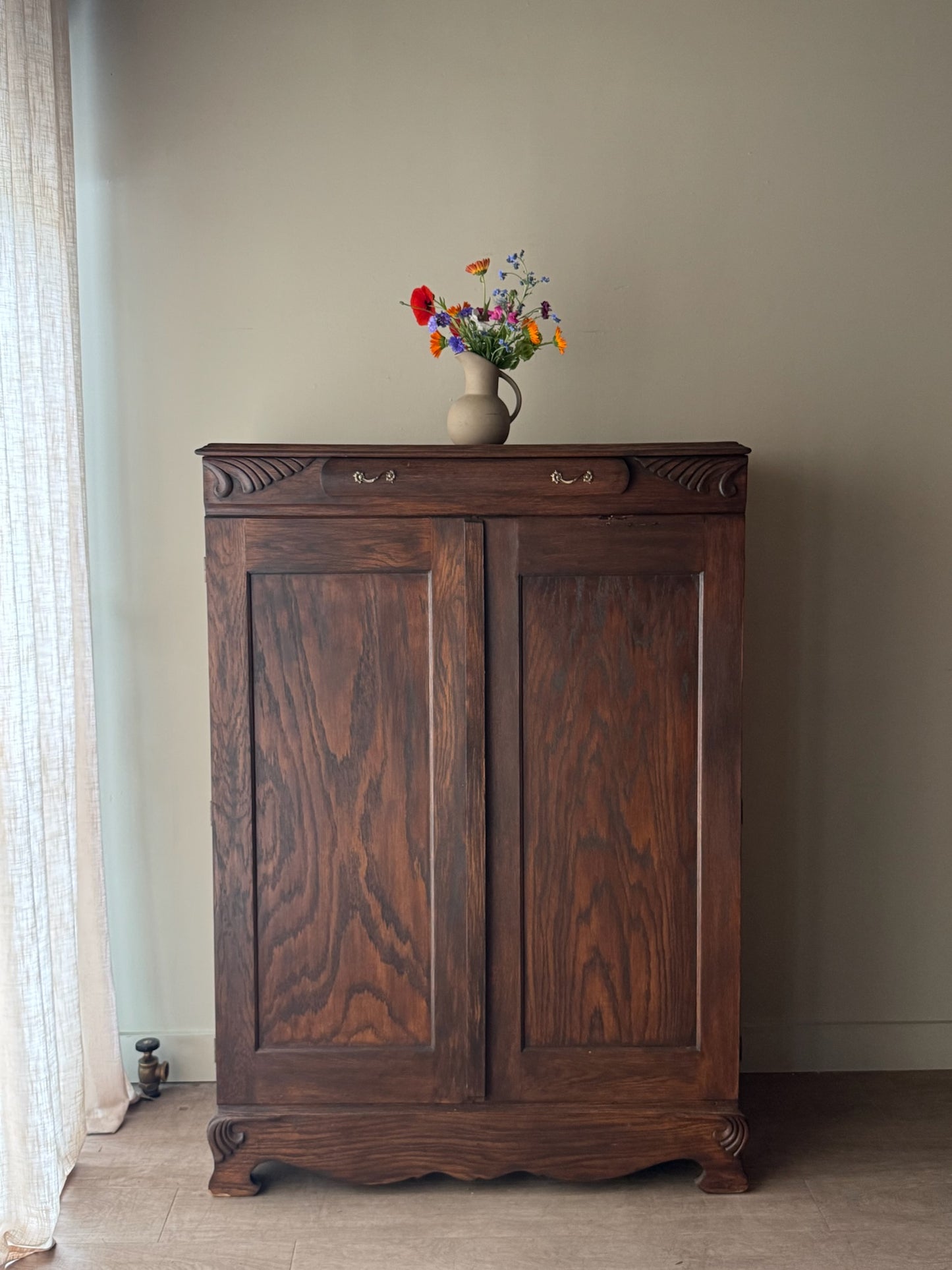 Golden oak cupboard with mirror