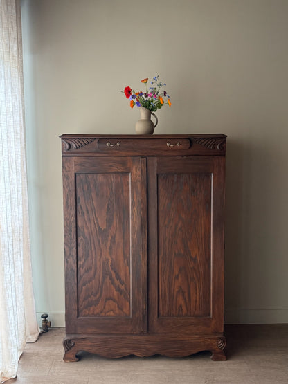 Golden oak cupboard with mirror