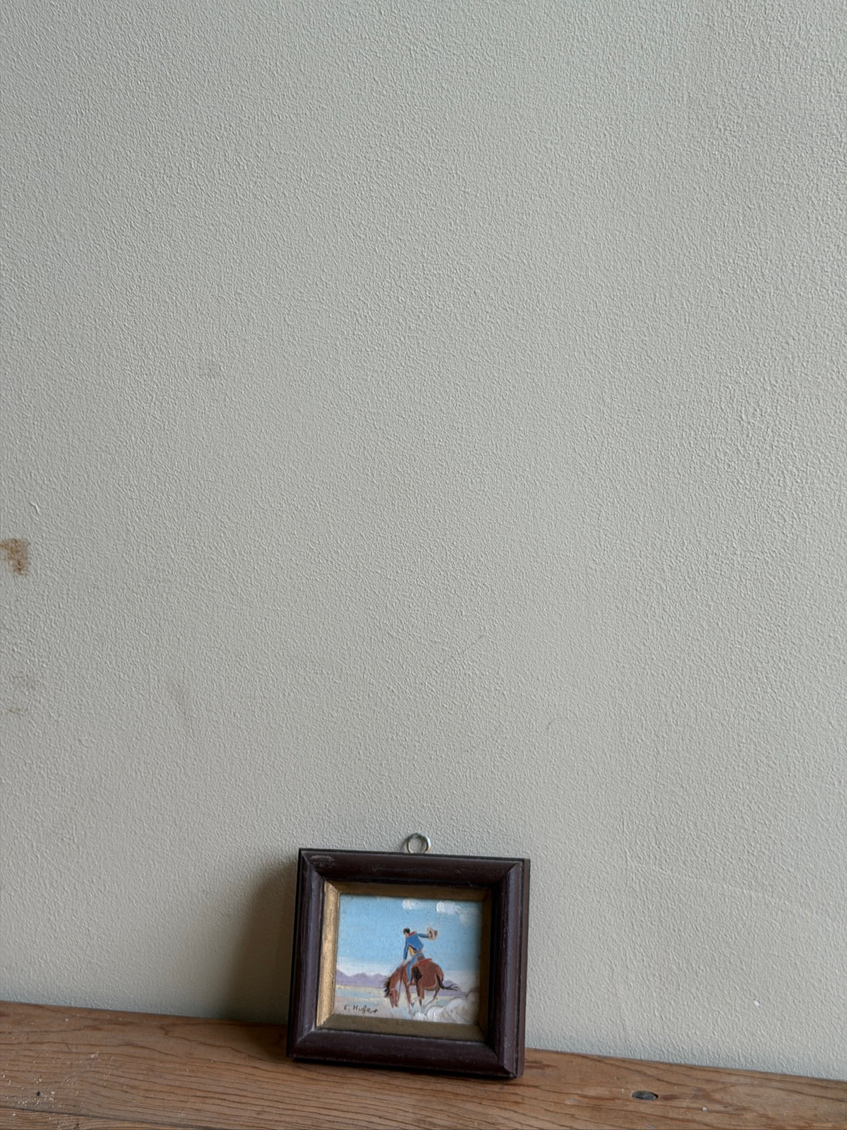 Small cowboy oil painting by E. Hofer