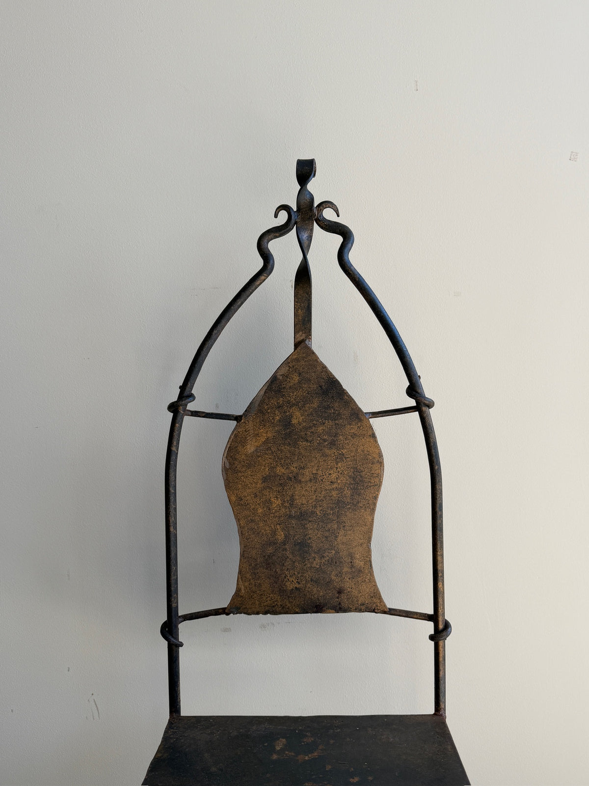 Wrought iron sculptural chairs (right)